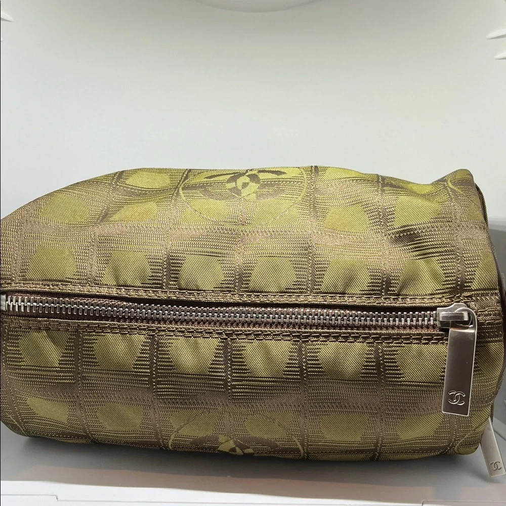 Chanel New Travel Line Mini Roll or Barrel Bag in a khaki or olive green color